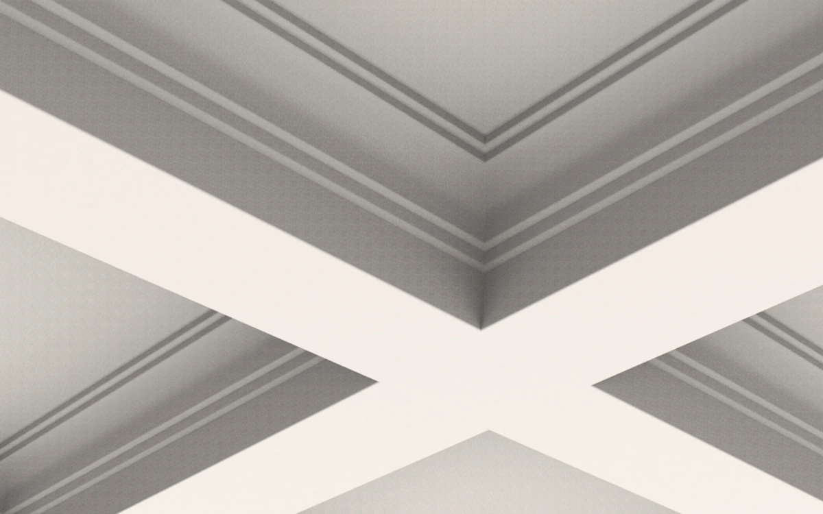 IB-10 white plaster ceiling beams with flat undersides and stepped inner borders, viewed from below.